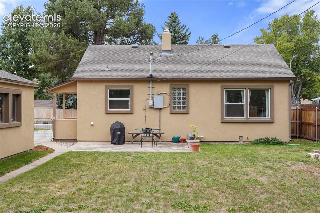 Image 14 of 23: Back yard with concrete patio