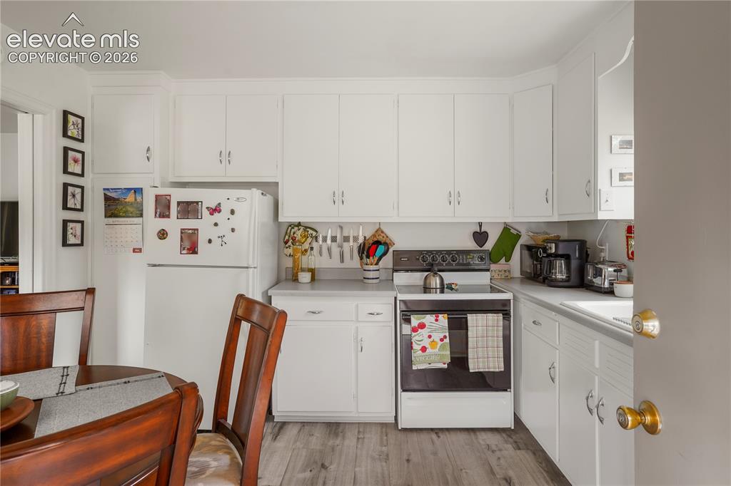 Image 9 of 23: Kitchen features unique and original cabinetry