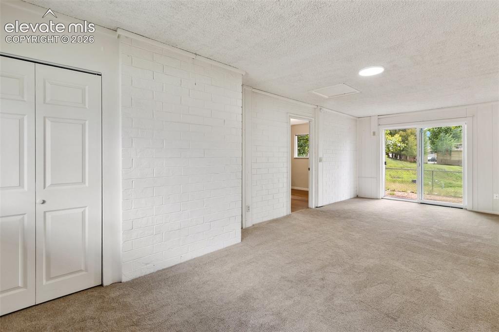 Image 11 of 25: Bonus bedroom or Family Room with walk out