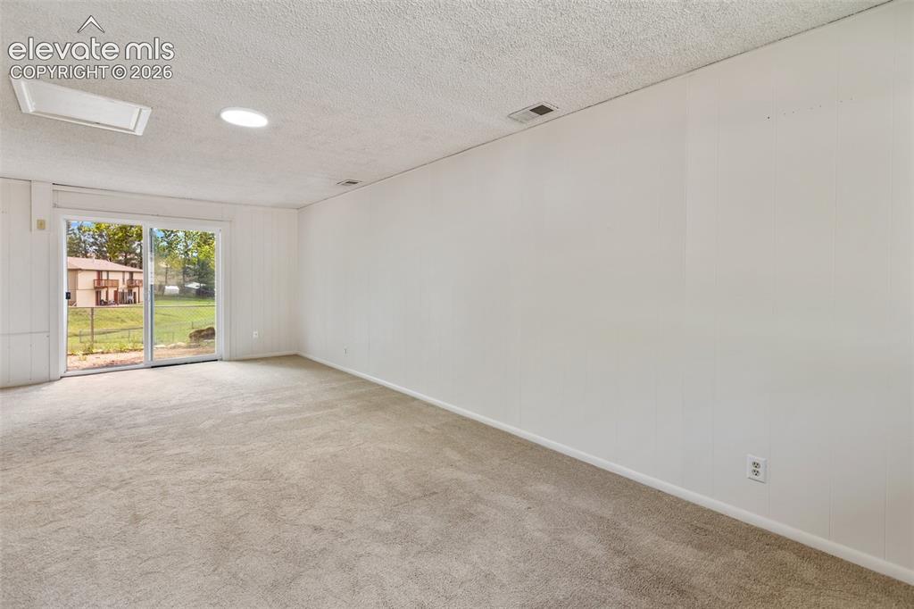 Image 13 of 25: Bonus bedroom or Family Room with walk out