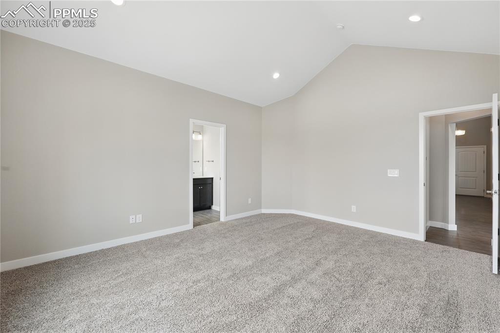 Image 13 of 25: Unfurnished bedroom featuring carpet flooring, ensuite bathroom, recessed l