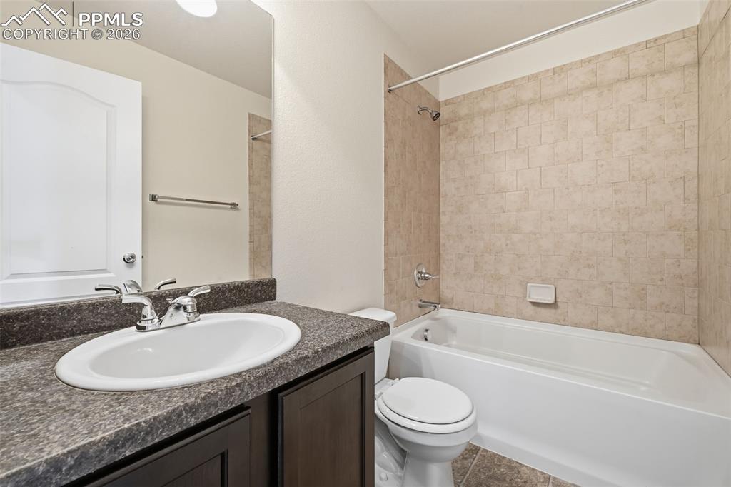 Image 20 of 28: Convenient full bath serving secondary bedrooms.