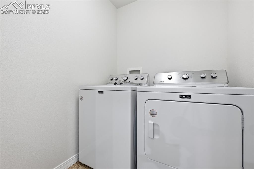 Image 21 of 28: Upper-level laundry with included washer and dryer adds everyday practicali