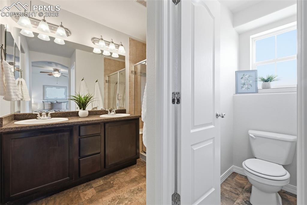 Image 9 of 28: Primary bath paired with a walk-in closet — offering both convenience and v