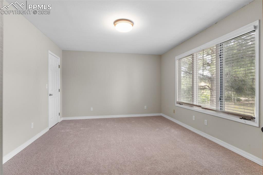 Image 16 of 35: Empty room featuring light carpet
