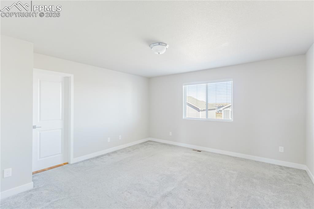 Image 18 of 46: Spare room with light colored carpet
