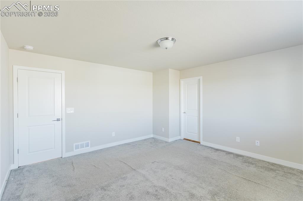 Image 19 of 46: Spare room with light colored carpet