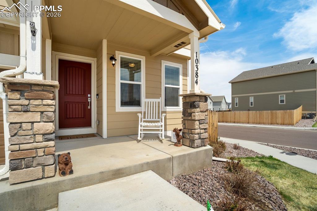 Image 3 of 46: Doorway to property featuring covered porch