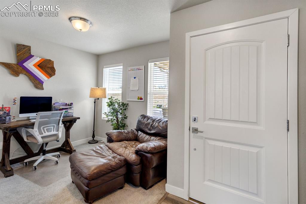 Image 4 of 45: Home office with a textured ceiling and baseboards