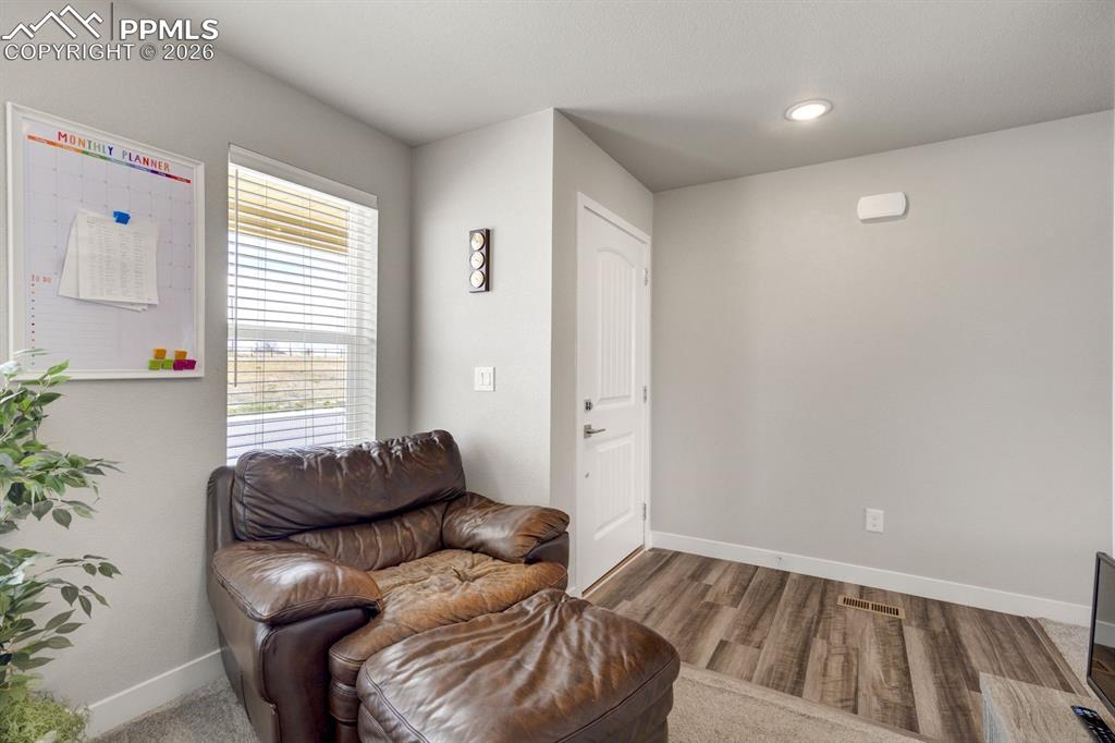 Image 6 of 45: Sitting room featuring baseboards and light wood-type flooring