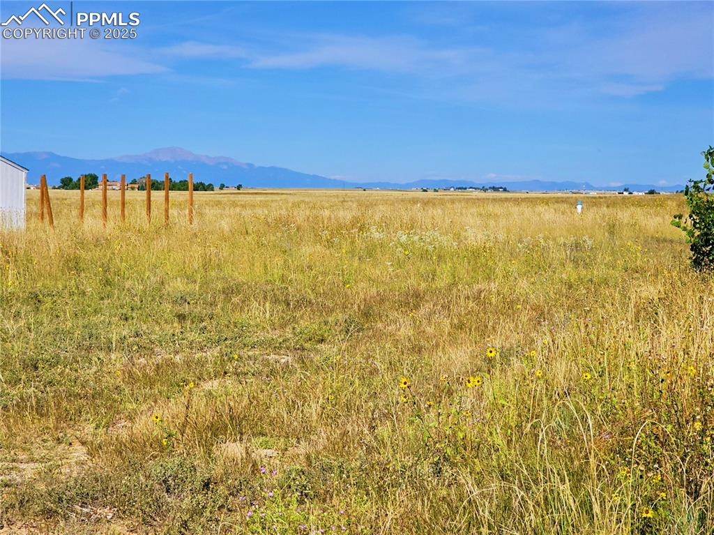 Image 3 of 6: View of mountain backdrop featuring rural landscape