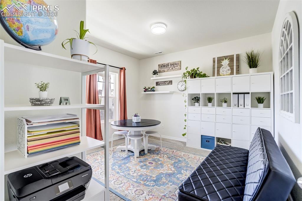 Image 16 of 45: Main Floor, Front Bedroom: perfect for office or flex room