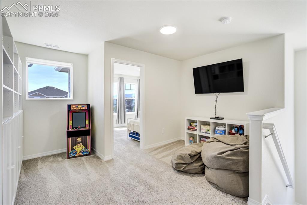 Image 22 of 45: Upstairs Loft Study/Play Area