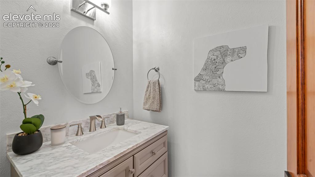 Image 24 of 45: Mian level half bath