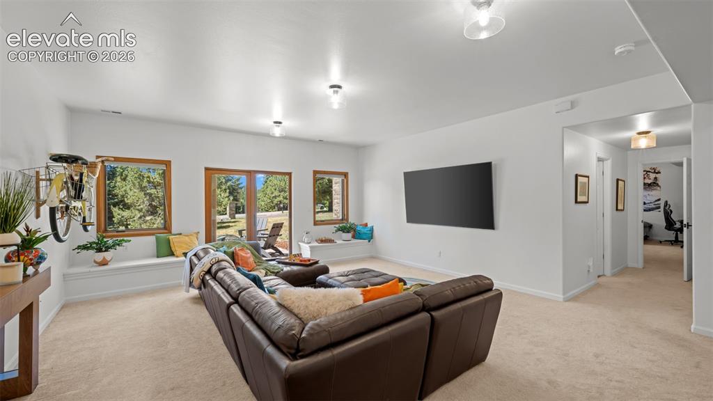 Image 29 of 45: Fun Family room walks out to patio