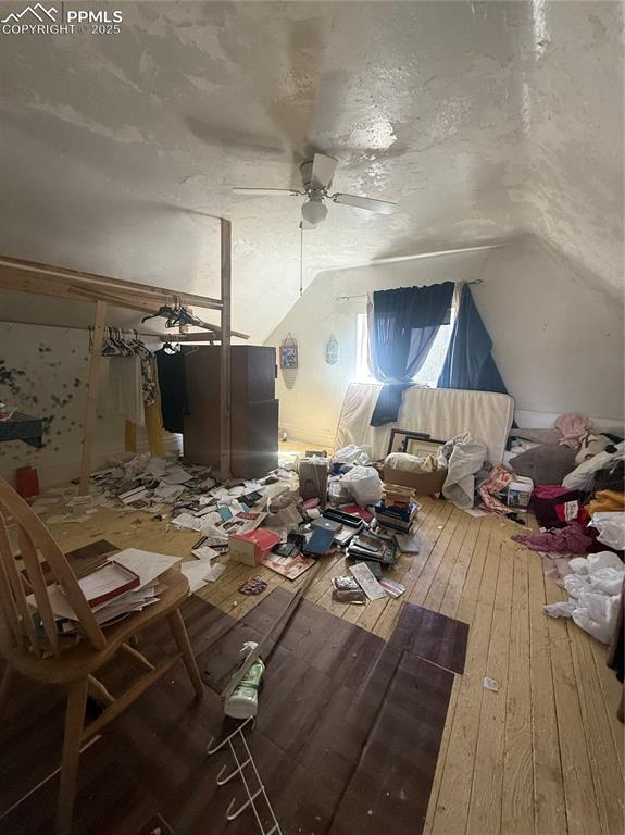 Image 10 of 14: Bonus room featuring lofted ceiling, a textured ceiling, hardwood / wood-st