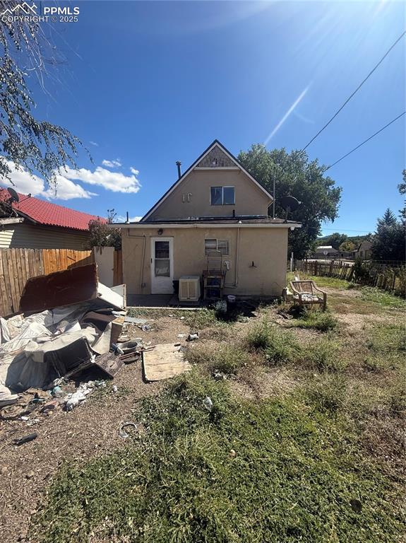 Image 14 of 14: Rear view of property with stucco siding