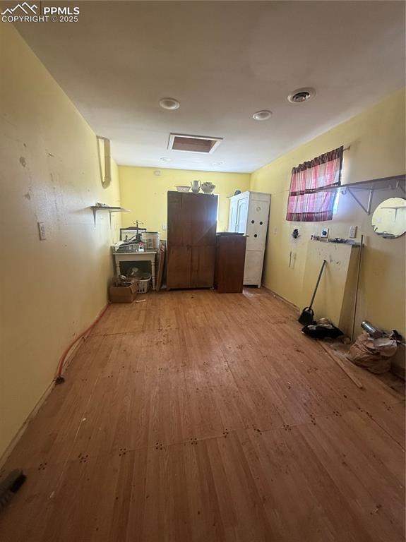 Image 4 of 14: Kitchen featuring hardwood / wood-style floors