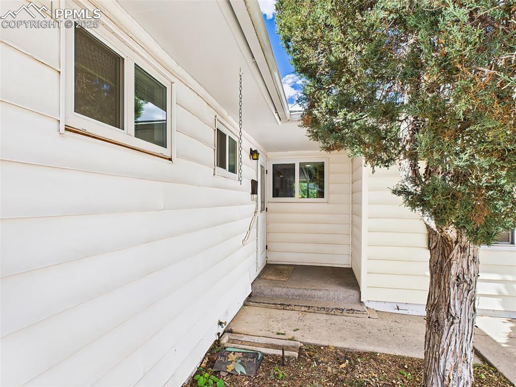 Image 2 of 40: Cute covered alcove entryway into home!