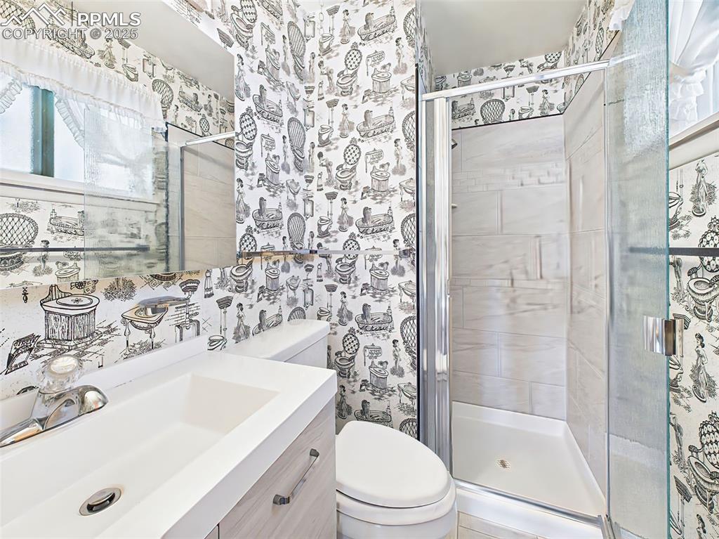 Image 24 of 40: Newer ceramic tiled walk-in shower with updated plumbing and fixtures!