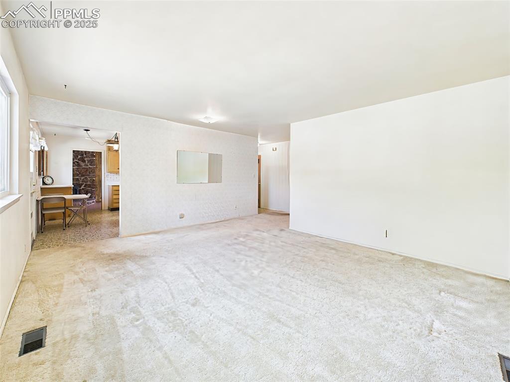 Image 8 of 40: View from living room looking toward kitchen and hallway!