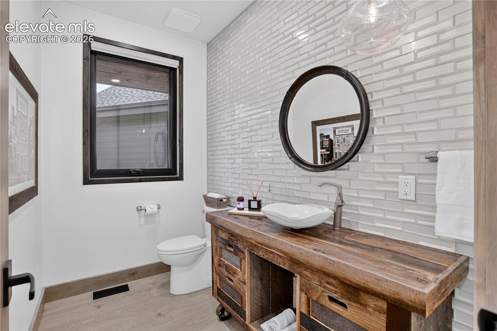Image 17 of 50: Main level powder room