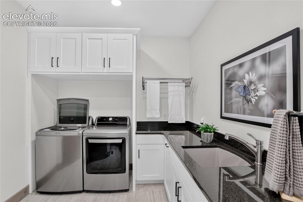 Image 19 of 50: Laundry room w/ abundant counter & cabinet space