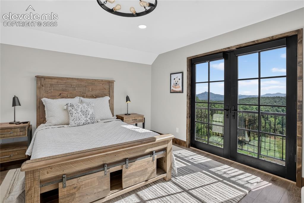 Image 34 of 50: Bedroom 4 w/ balcony & mountain views - guest suite