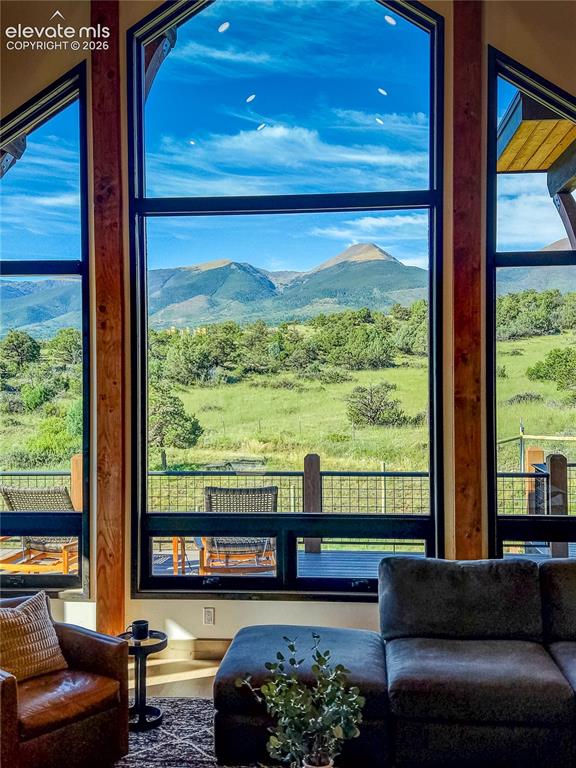 Image 5 of 50: 17-foot windows framing mountain views