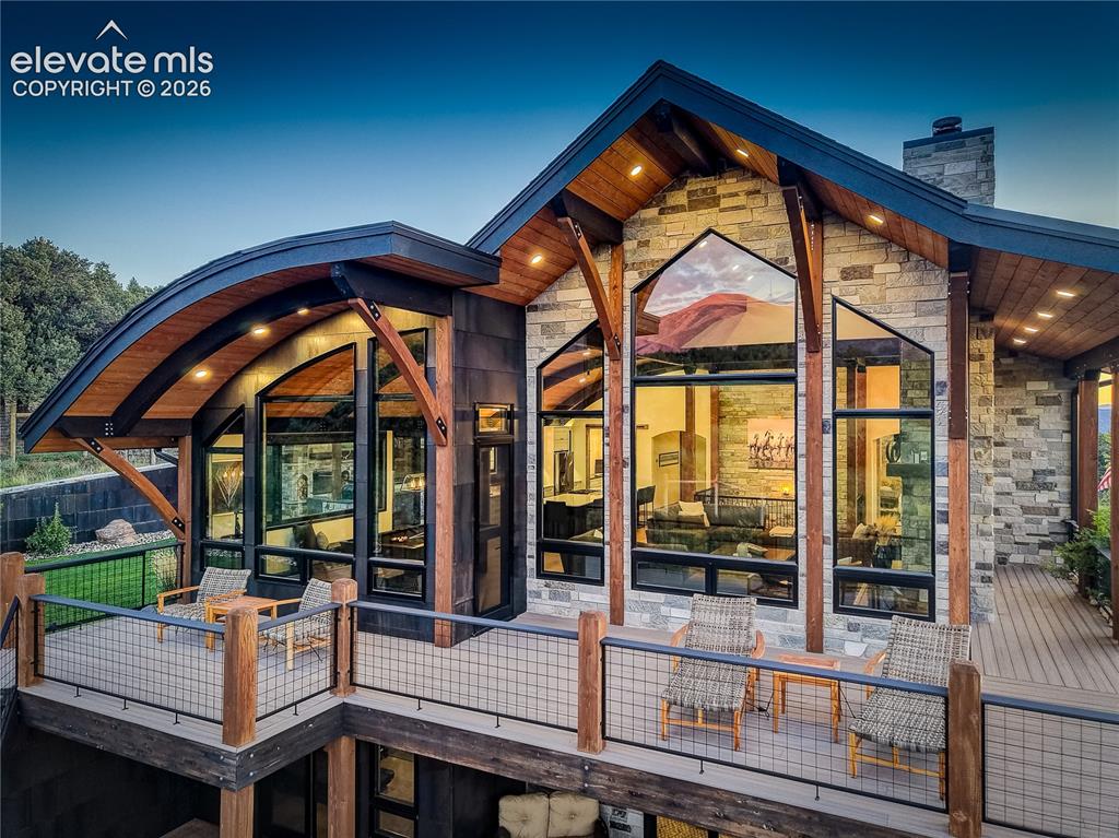 Image 6 of 50: Spacious side deck looking toward mountains