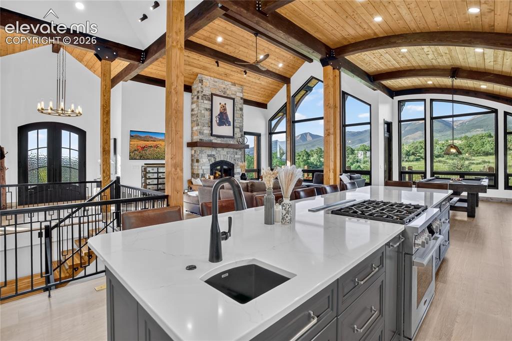 Image 9 of 50: Large quartz island & solid wood cabinetry