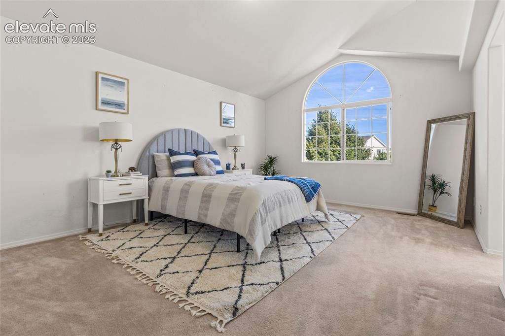 Image 15 of 33: Primary Bedroom with Vaulted Ceilings