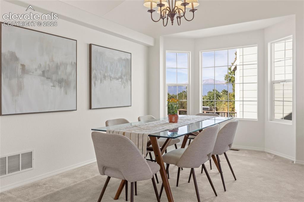 Image 2 of 33: Gorgeous Dining Room with View of Pikes Peak