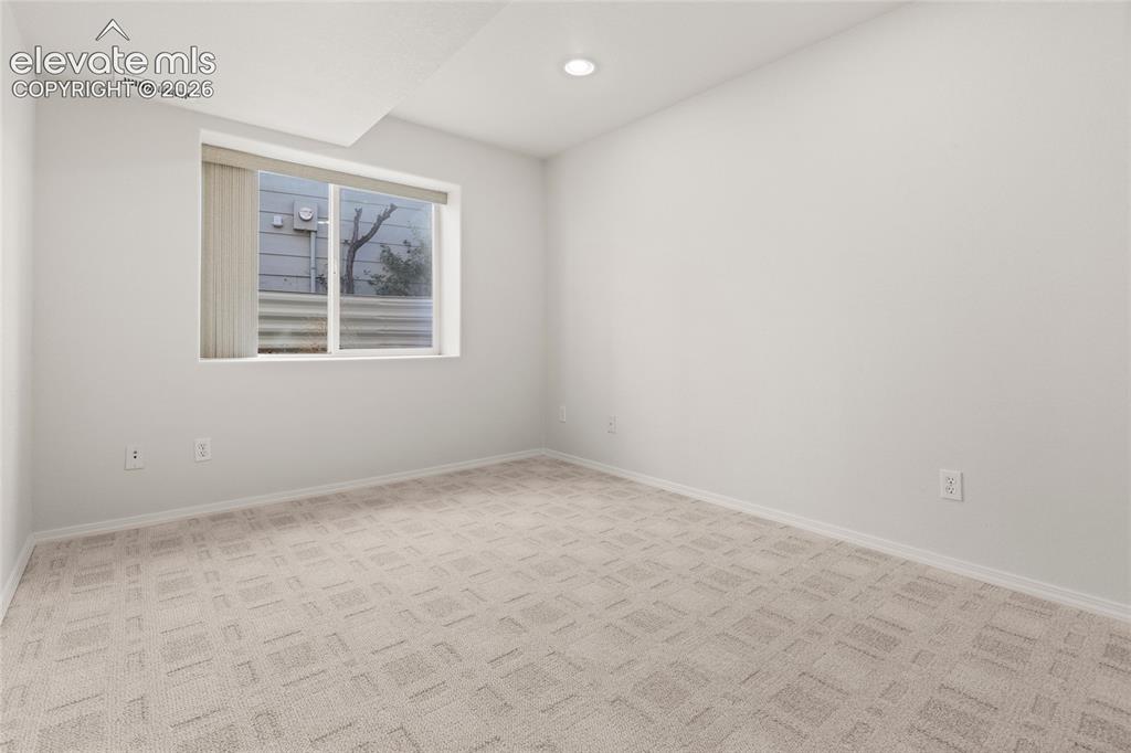 Image 25 of 33: Basement Bedroom with Large Walk-In Closet