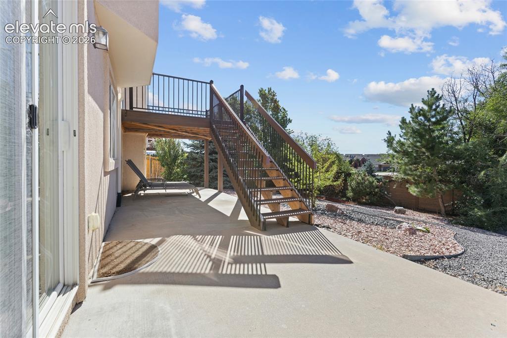 Image 30 of 33: Xeriscape Backyard with Walk-Out Access and Deck Access