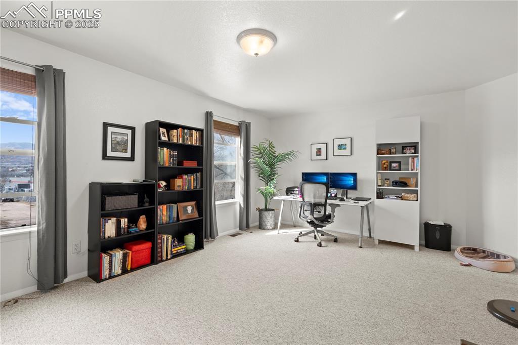 Image 15 of 40: Carpeted office featuring baseboards