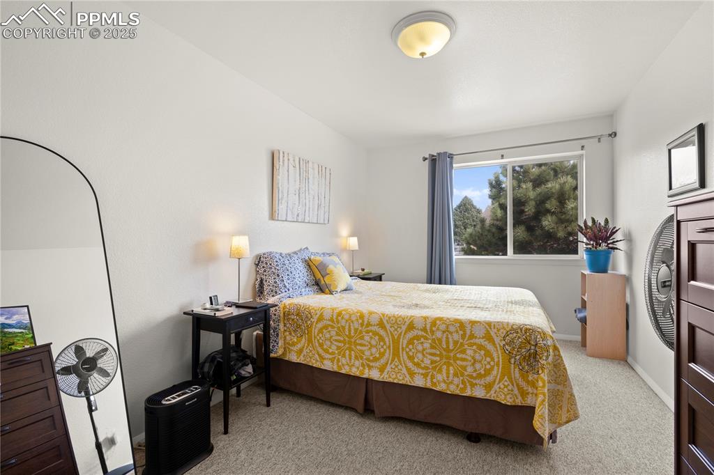 Image 19 of 40: Bedroom with baseboards and carpet