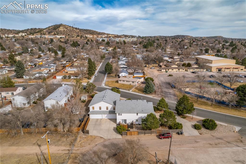 Image 32 of 40: Drone / aerial view with a residential view and a mountain view