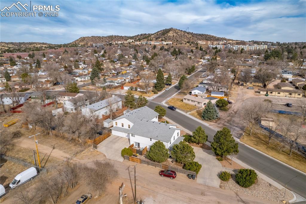 Image 33 of 40: Aerial view featuring a mountain view and a residential view