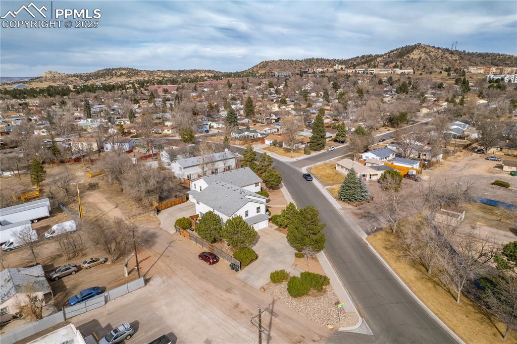 Image 34 of 40: Aerial view featuring a mountain view and a residential view