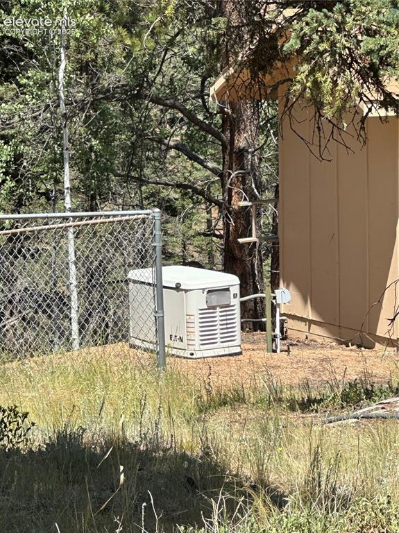 Image 36 of 50: 17KW Generator: powers whole house, runs on natural gas so no need to buy f