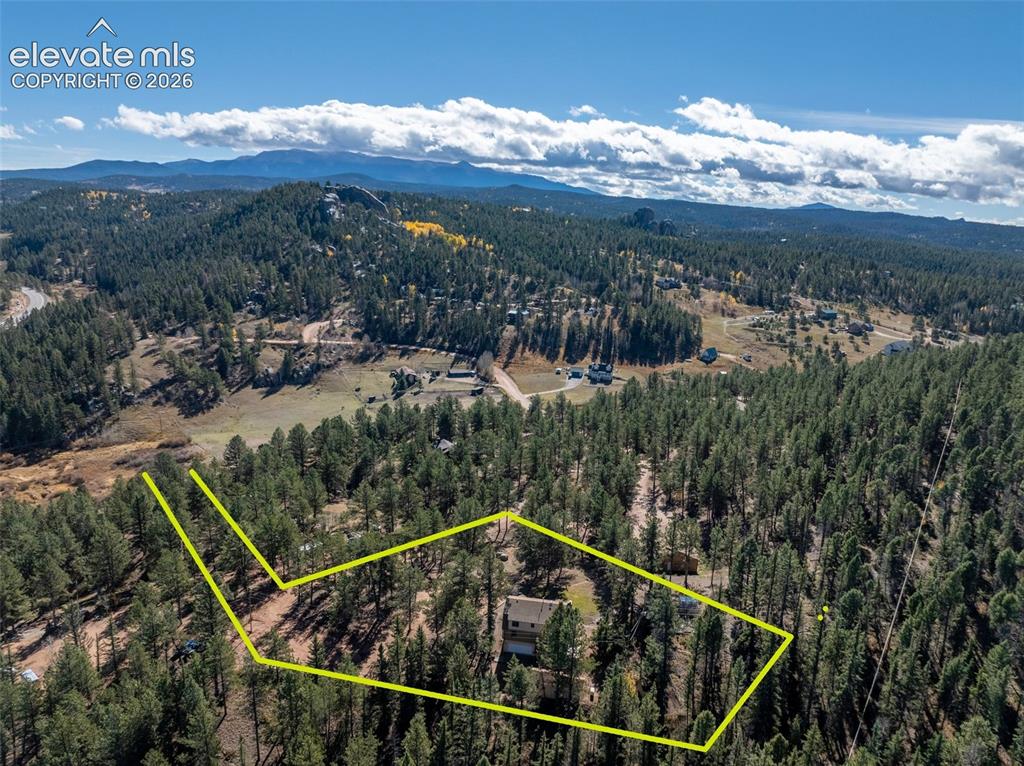 Image 40 of 50: Aerial view house which sits on included Lot 106 with 2432 sq. ft. house on