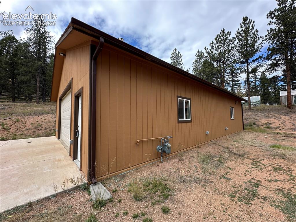 Image 49 of 50: Natural gas for heat. Concrete apron. Exterior electrical outlets.