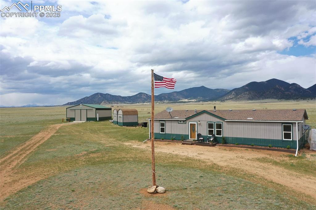 Caption: House, 2 sheds & Cleary bldg w/concrete floor. 