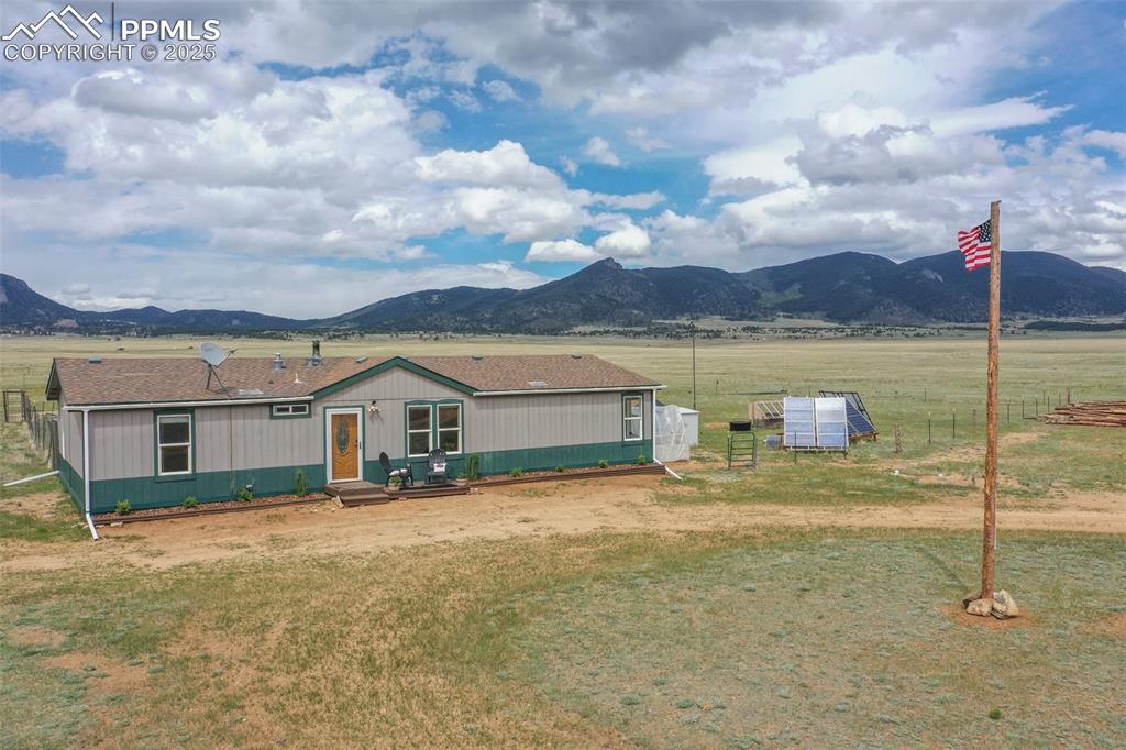 Image 2 of 49: Looking E, solar array and yard