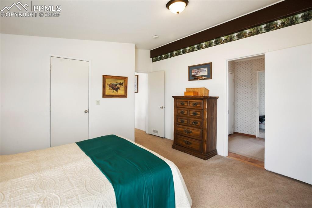 Image 23 of 49: Bedroom featuring carpet floors