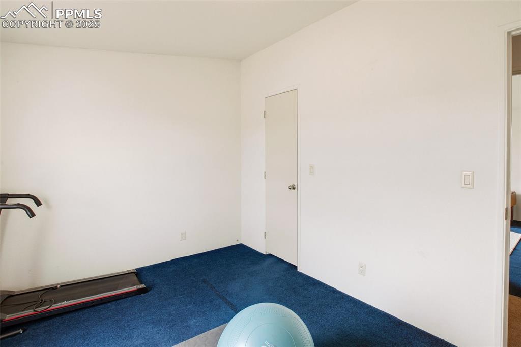 Image 32 of 49: Empty room featuring carpet flooring