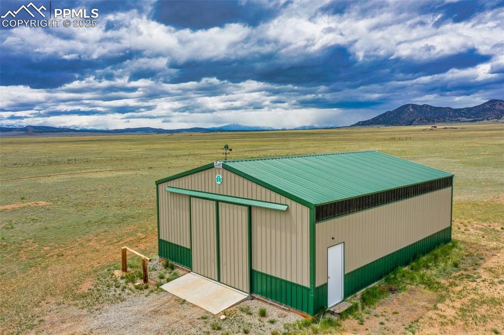 Image 8 of 49: View of pole building with a mountain view and a view of countryside