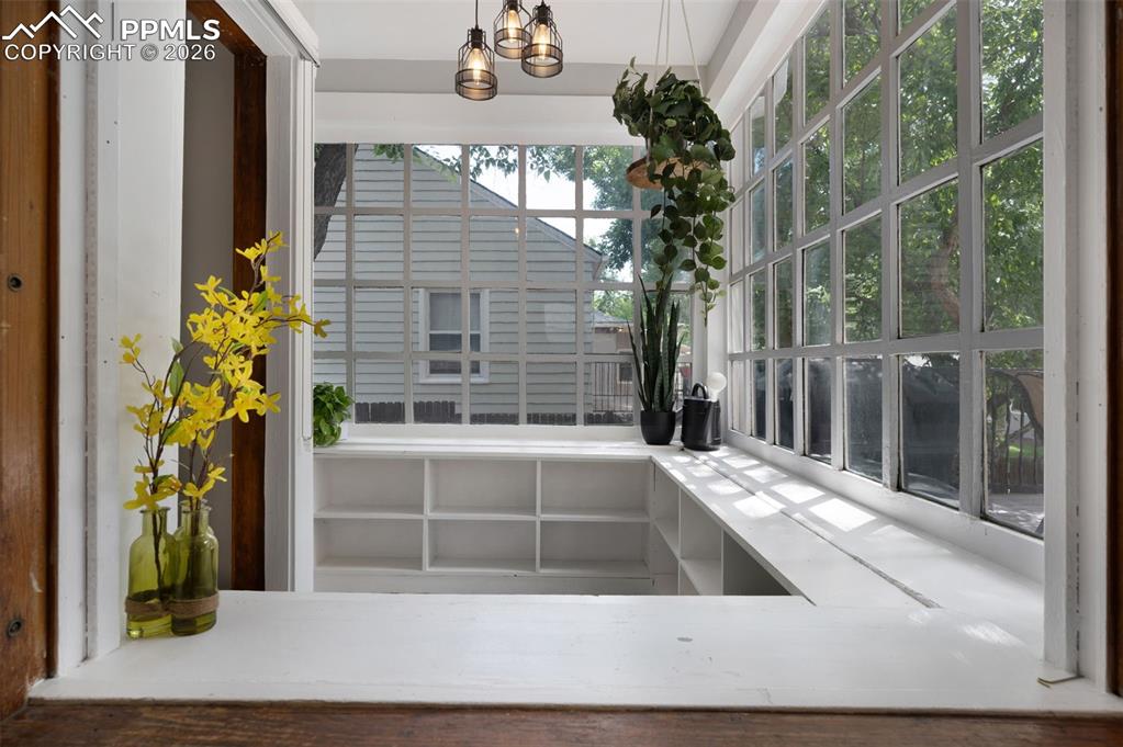 Image 12 of 28: Garden room off of living room