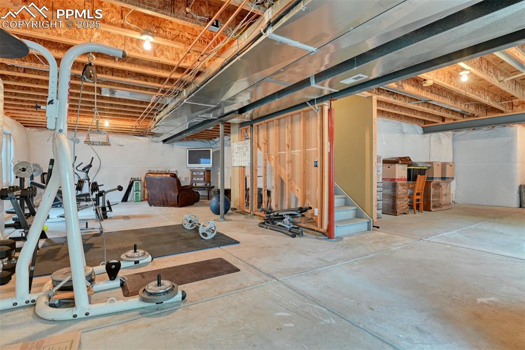 Image 43 of 49: Unfinished basement featuring stairs